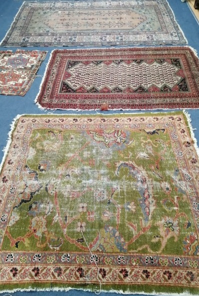 A Caucasian cream ground rug with central field of boteh motifs, 148 x 101cm and three other rugs